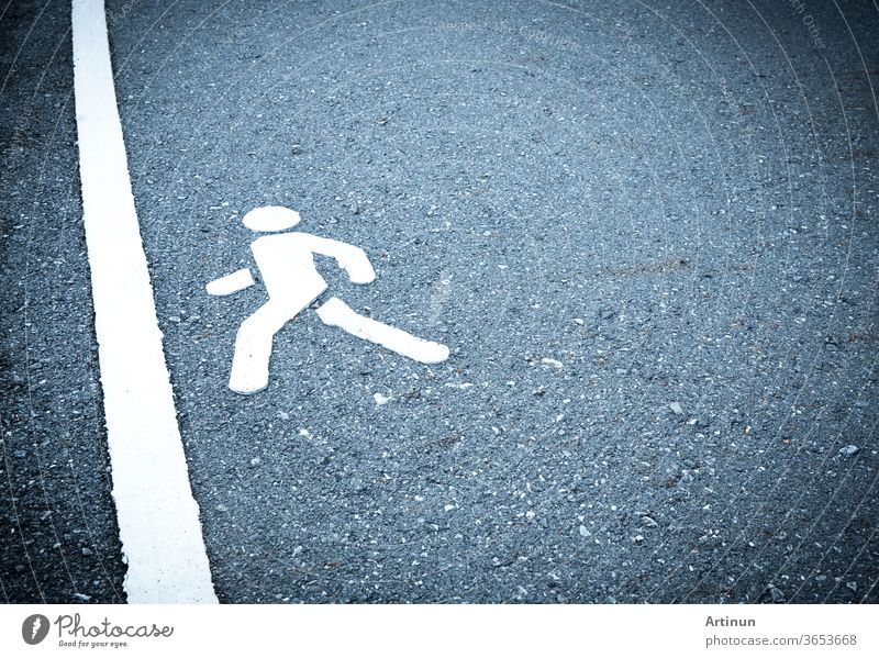 White painted sign on asphalt. People are going to step into the finish line. Do not be afraid to step over obstacles concept. pedestrian lane abstract