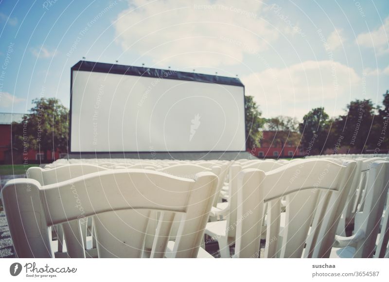 big outdoor cinema screen with chairs in front Introduction Seating capacity Seating arrangements spectators Empty viewless Open-air performance Open air cinema