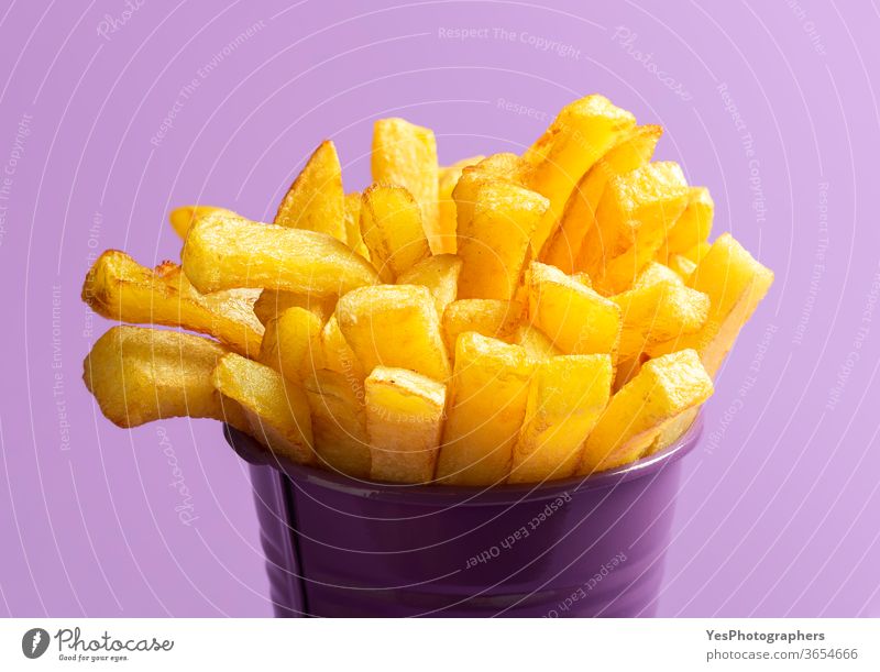 French fries close-up. Deep-fried food. French fries on purple background american calories chips cholesterol crispy cuisine deep-fried delicious dinner