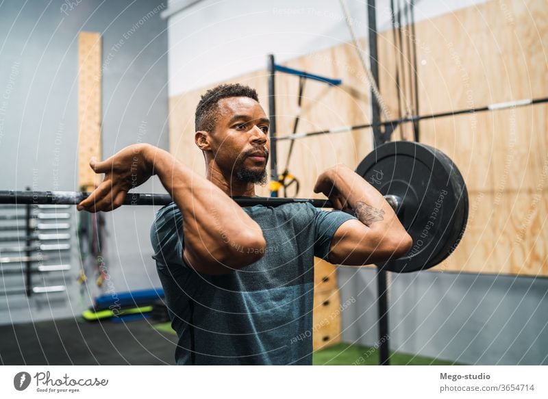 Man athlete isolated on white background. Gym full body workout. Muscular  man athlete in fitness gym have havy workout. Sports trainer on trainging.  Fitness motivation. Stock Photo