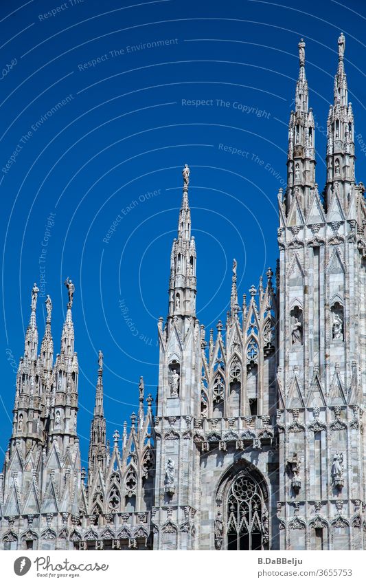 The facade of the Milan Cathedral in front of a blue sky. Italy Architecture Europe Town Exterior shot Tourism Vacation & Travel Historic Old town built