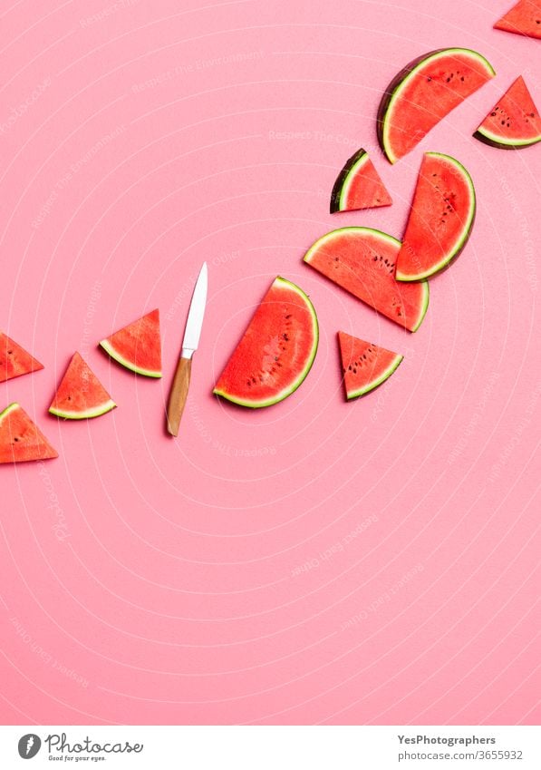 Watermelon slices flat lay on a pink background. Fresh summer fruits above view arranged cut out delicious dessert diet dieting food fresh green healthy eating