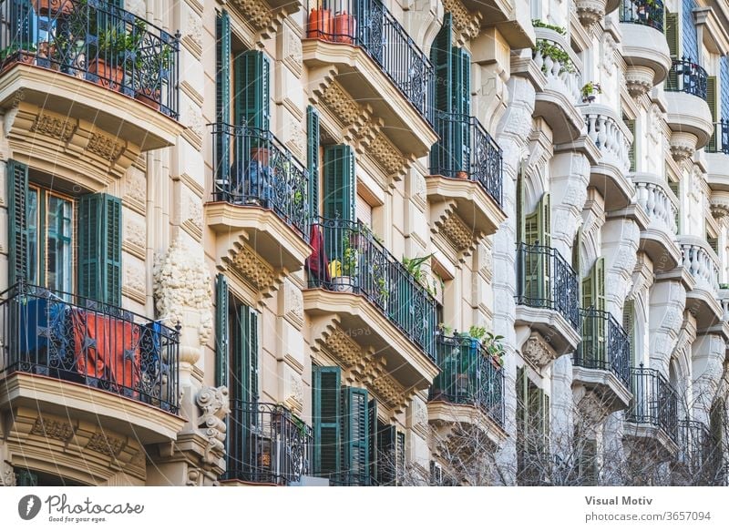 Low angle view of rows of neoclassical balconies on the facade of a residential building pot balcony plant exterior ornament construction old style railing