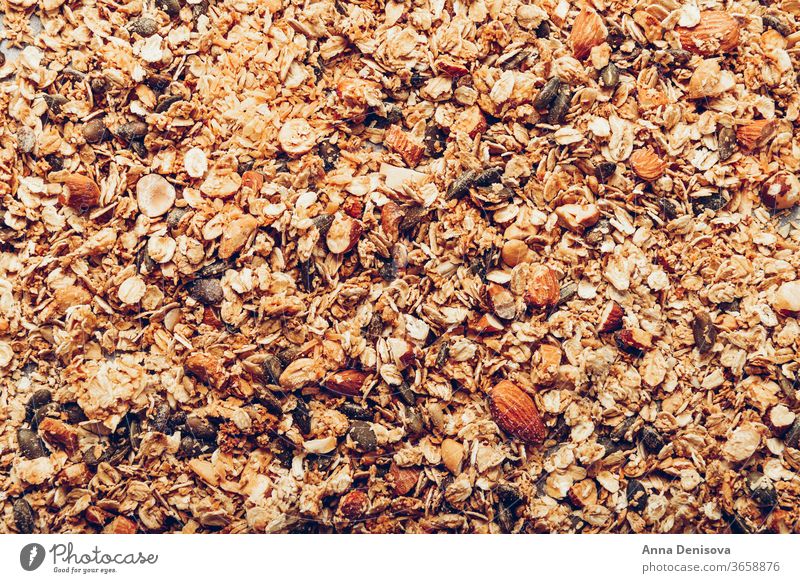 Homemade gluten free granola sugar free oat homemade sweet nuts healthy grain diet seed breakfast roasted sunflower maple syrup muesli food organic top crunchy