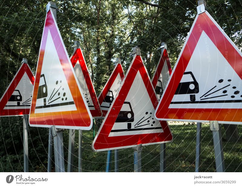 One cannot warn often enough against uncontrolled flying loose chippings Road sign StVO Triangle rolled gravel Many Warning sign Collection Red Preparation