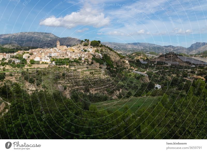 Panorama view of the hills of Polop de Marina with church and castell over green forest at the Costa Blanca, Spain polop spain mountain travel architecture