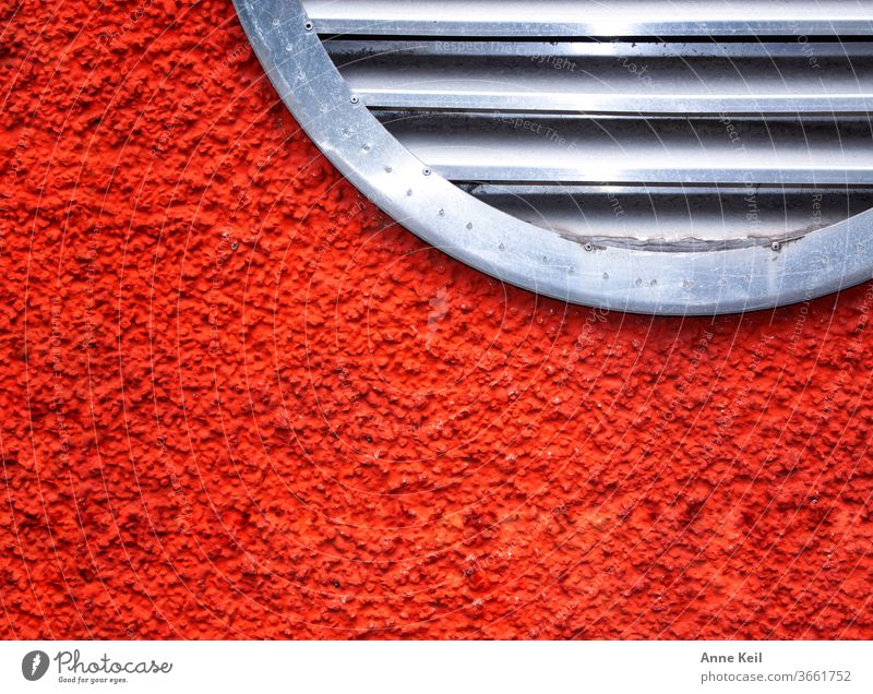Bright red and orange house wall with round ventilation grille Facade Exterior shot Wall (building) Colour photo Deserted Day Wall (barrier) Red Orange Silver