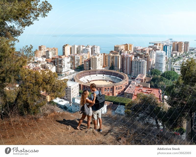 Romantic couple enjoying picturesque cityscape of Malaga embrace scenery wonderful seascape malaga viewpoint romantic spain scenic peaceful wanderlust carefree