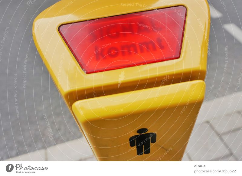 She hopes that HE will finally send a signal - "SIGNAL is coming" is illuminated at the yellow traffic light button Traffic light push button Signal coming