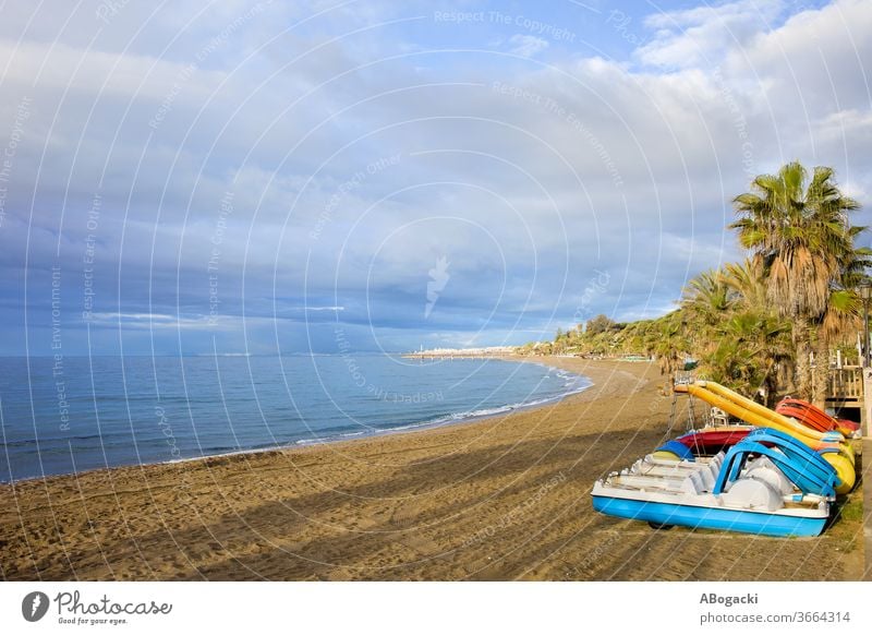 Sea beach with paddle boats on Costa del Sol in Marbella, Andalusia, Spain spain marbella costa del sol vacation sea holidays leisure travel tourism europe