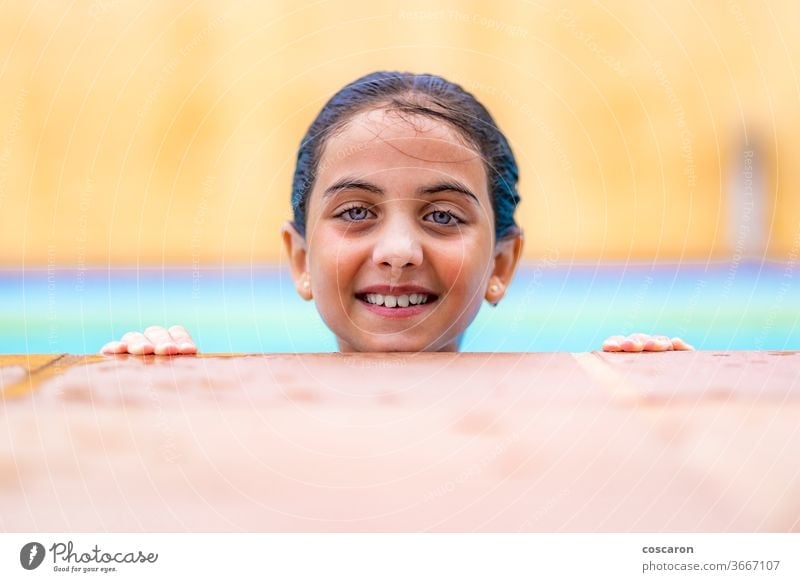 Cute young boy relaxing in a pool - a Royalty Free Stock Photo