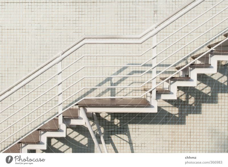 White Teppe on white ground Wall (barrier) Wall (building) Stairs Facade Metal Design Banister Ascending Tile Connection Lanes & trails Shadow Parallel