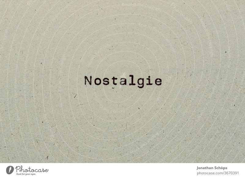 Nostalgia as text on paper with typewriter Paper Recycling recollection Review Typewriter writing typography Analog Former Retro Text Copy Space vintage Vintage