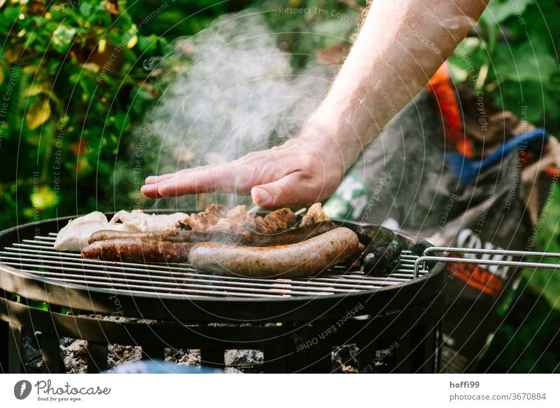 the little temperature check on the barbecue-- it's gonna... BBQ by hand charcoal grill Small sausage barbecue food grilled meat Barbecue (apparatus) Nutrition