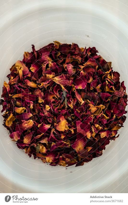 Dried rose petals in cup ceramic dried herb kitchen ingredient flora season aroma mug flower natural organic foliage pile plant heap tea delicate tradition