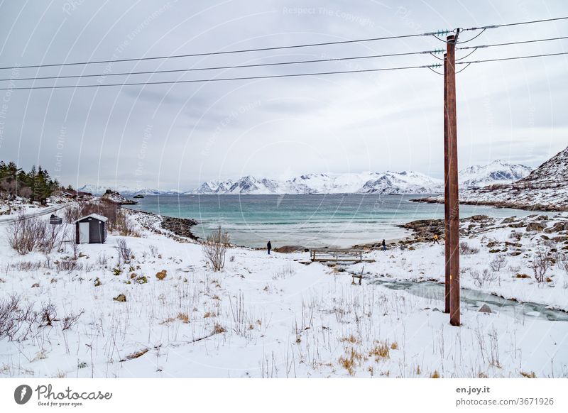 Snow landscape at a bay on the Lofoten Lofotes Lofoten Islands Norway Scandinavia Winter chill Snowscape Ocean River Ice Bay Beach Rock vacation voyage