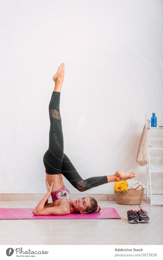Pleasant Slim Woman Standing on the Yoga Mat Stock Photo - Image