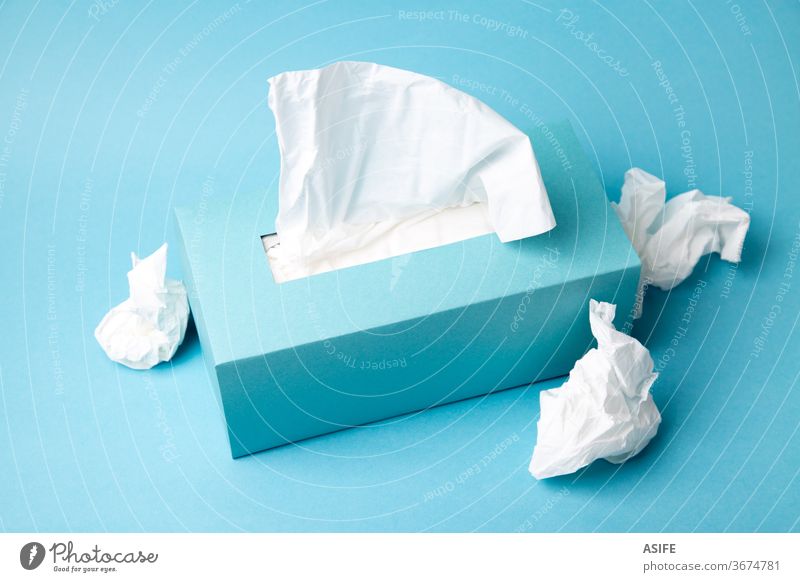 Cold and flu concept with a tissue box and crumpled tissues disposable health prevention cardboard container dispenser mockup blank space packaging facial care