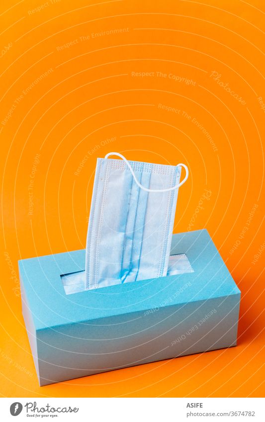 Download Disposable Blue Face Mask Box On Orange Background A Royalty Free Stock Photo From Photocase