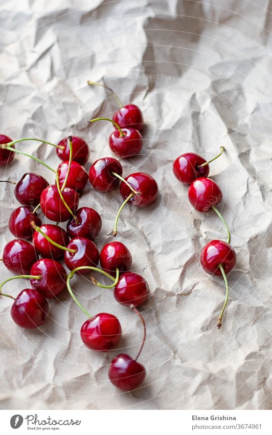 Berries of ripe cherries on a background of craft paper sweet cherry red fresh organic dessert healthy diet berry summer fruit food raw vegetarian natural