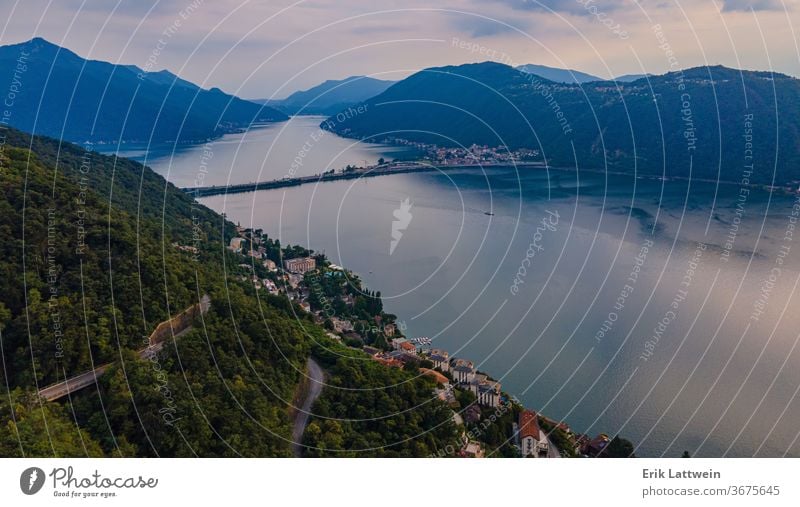 Aerial view over the Lake Lugano in Switzerland - evening view aerial alps beautiful blue city europe green lake landscape lugano mountain nature outdoor scenic