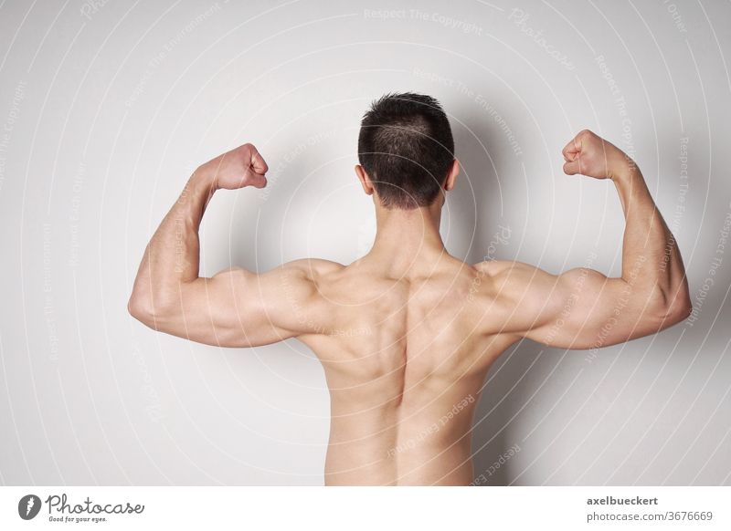 Biceps concept. Athlete show biceps and triceps, back view. Man flex arms  with biceps. Biceps muscle of arms Stock Photo
