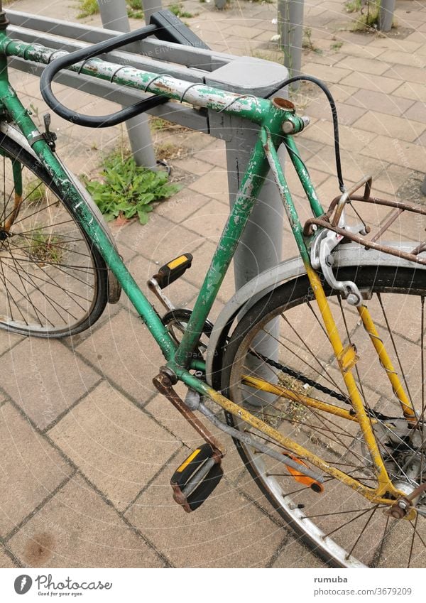 Old, defective bicycle Bicycle Broken Rust Derelict Means of transport rickety Wheel Colour photo Exterior shot Decline Driving Cycling Town Past Long shot Day