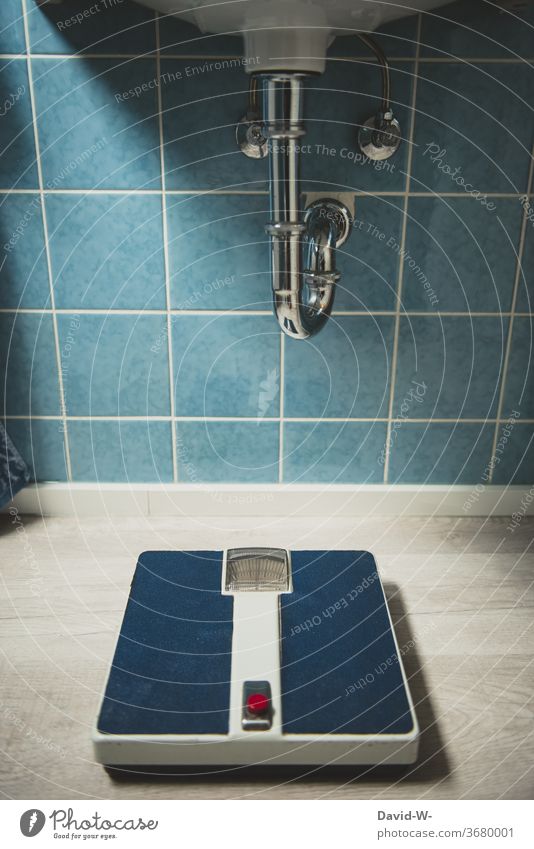 an old scale in a bathroom from a bygone era Scale Old Past Former '60s 1970s Style Weigh Weight Ground Old fashioned Period apartment Blue wall tiles Retro