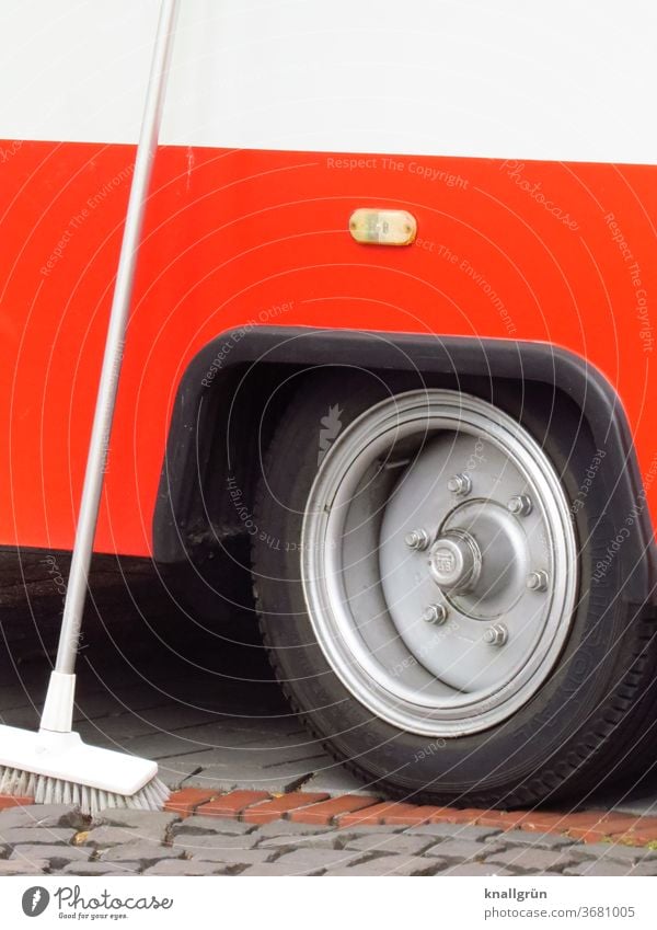 White scrubbing brush leaning against the back of a red sales trolley Vehicle Stall Tire Wheel Detail Exterior shot Transport Car Truck Trailer Colour photo