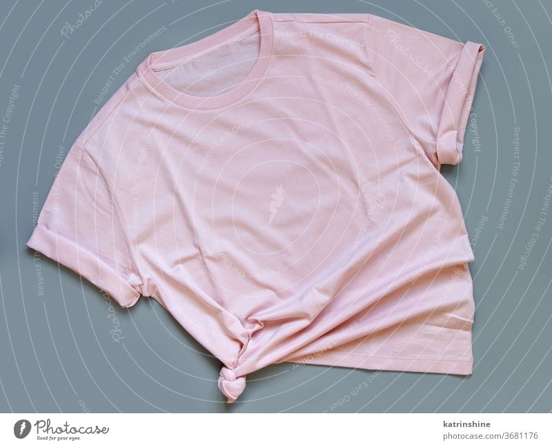 Pink t-shirt mock up flat lay on grey background - a Royalty Free Stock  Photo from Photocase