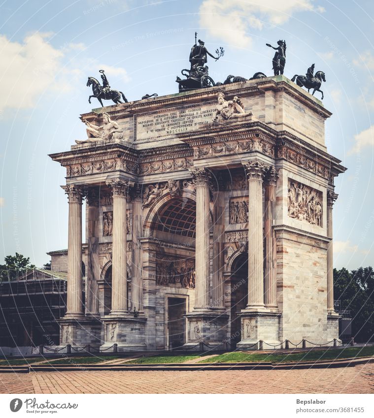 View of the Arco della Pace, triumphal arch in Milan, taly milan architecture gate entrance sempione park bow branches celebration entry heritage lawn italy