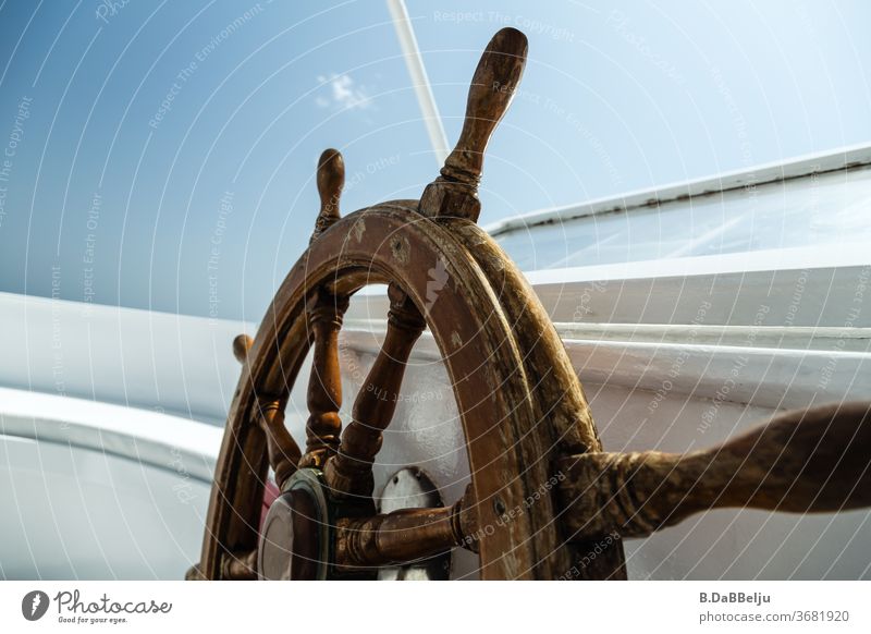 The steering wheel on the upper deck is exposed to the weather at sea every day. Tough life... Dive Exchange Safari tax Steering wheel Lake Ocean Blue boat ship