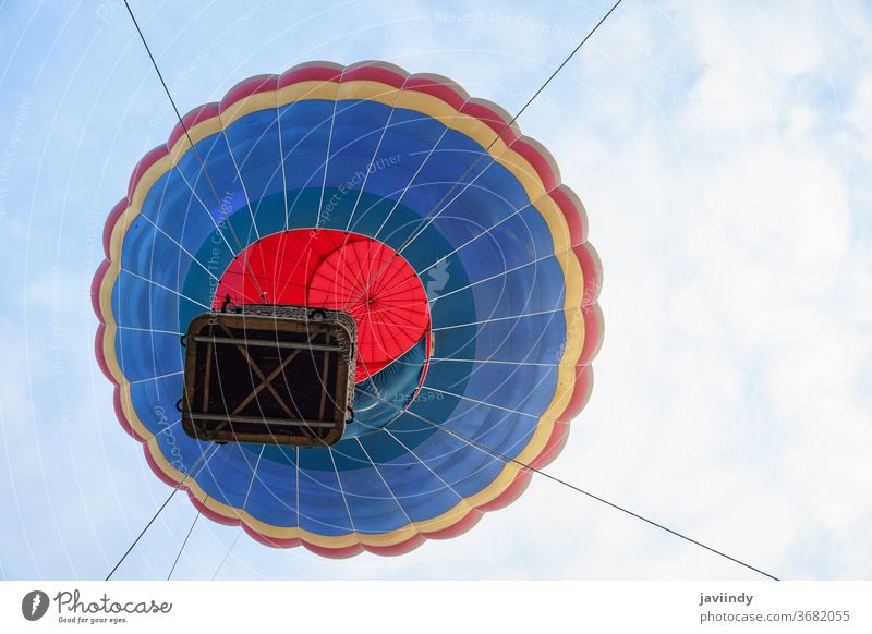 Captive balloon in Aeroestacion Festival in Guadix air hot guadix granada festival aeroestacion flight sky basket fly colorful silk clouds float launch blue