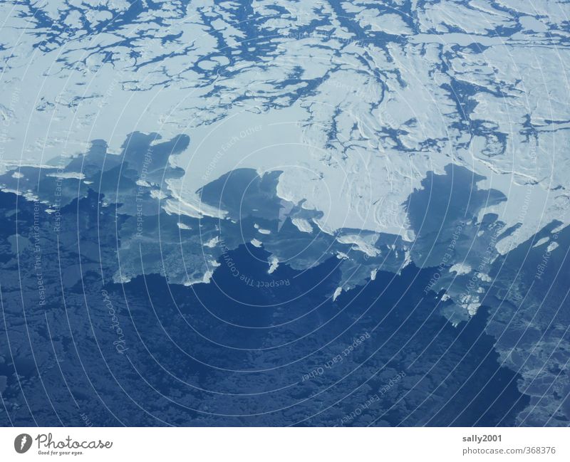 Ice Age Nature Climate change Frost Snow Coast Ocean Atlantic Ocean Canada Newfoundland Americas Aviation View from the airplane Esthetic Cold Blue White