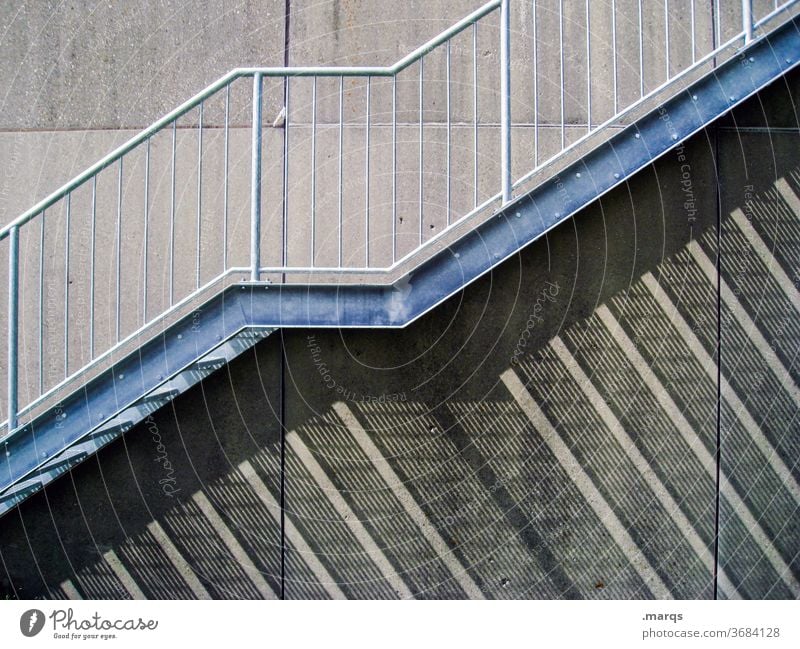upstairs Stairs Wall (building) Shadow Shadow play Banister Esthetic Facade Contrast Structures and shapes long shadows Upward lines Gray ascent