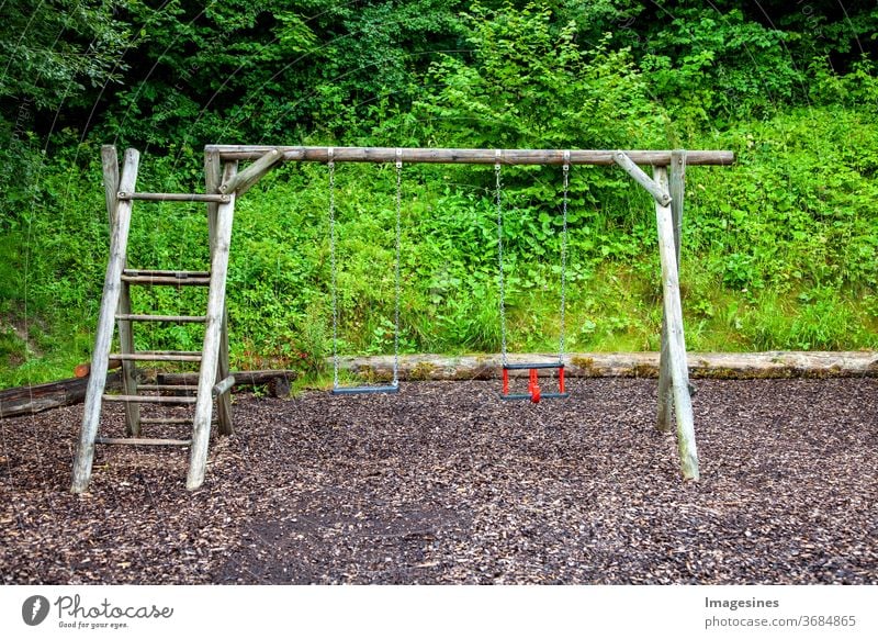 Empty chain swing on playground children's playground covid-19 pandemic Virus Playing Playground Park Nostalgia forsake sb./sth. silent coronavirus lockdown