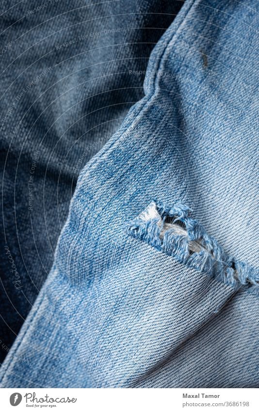 Detail of blue jeans texture apparel backdrop background canvas casual closeup cloth clothes clothing copyspace cotton denim detail dirty fabric fashion fold