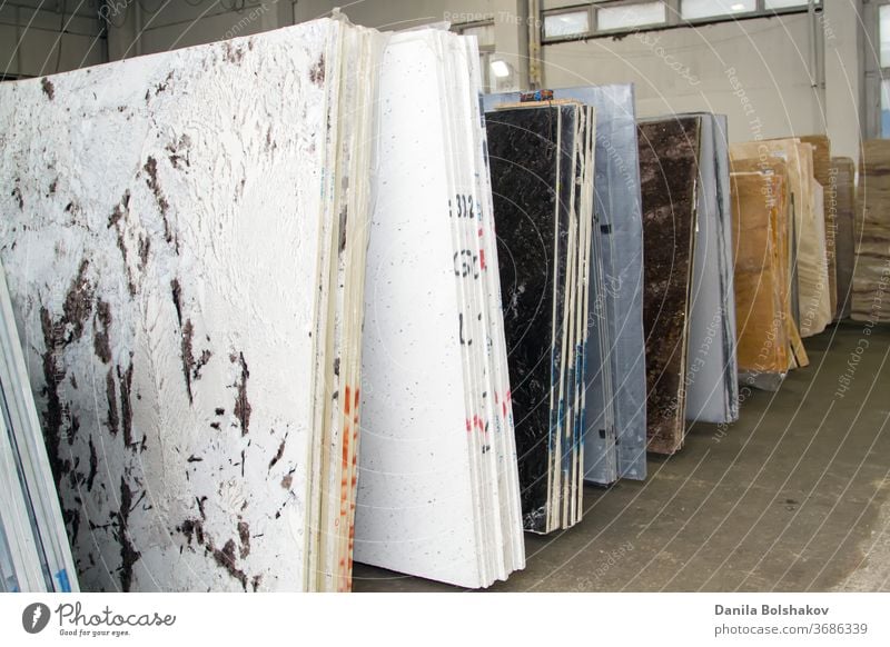 Colorful marble slabs in store show room. Granite slabs are prepared for sale in store yard granit nacre countertop stock industry industrial polished stone