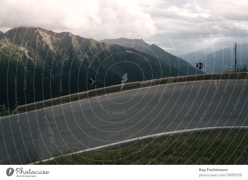 serpentine mountain road with mountain range adventure alpine alps curve dangerous destination dolomites environment europe high hiking landscape mountains