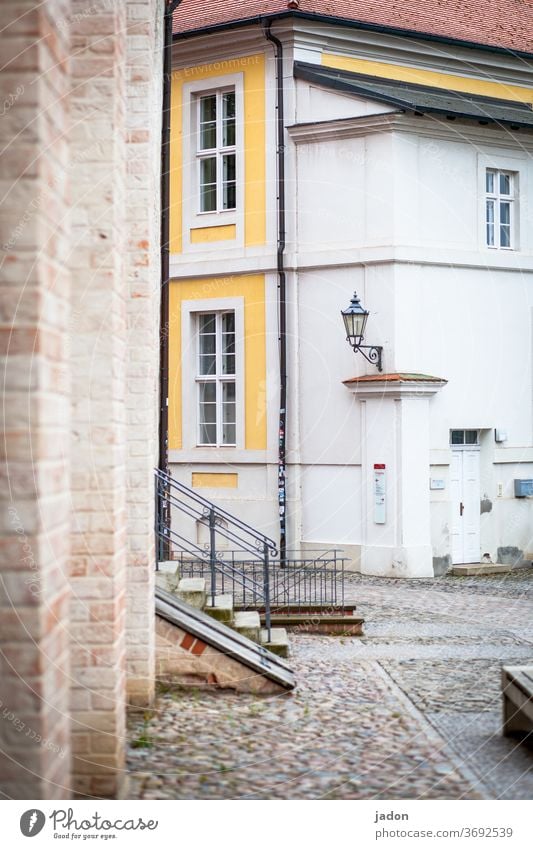 stairs to the courtyard. Stairs Facade Exterior shot Deserted Wall (building) Wall (barrier) Colour photo Architecture Manmade structures built Town