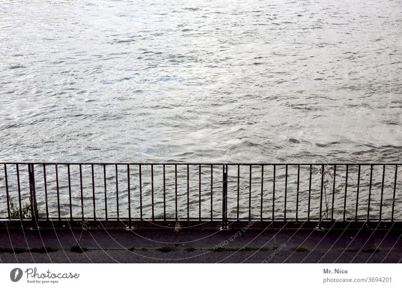 handrail at the waterfront Water River Handrail Safety Metal demarcation bank River bank Grating Body of water Flow Lake Waves Footbridge parapet Protection