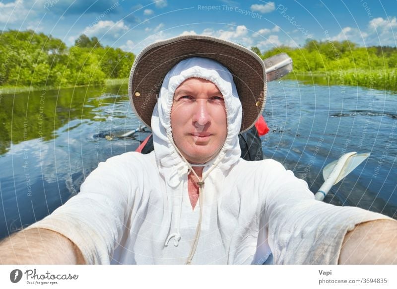 Smiling man taking selfie photo on kayak water river fun smiling man canoe summer adventure outdoor sport young vacation nature people lifestyle travel activity