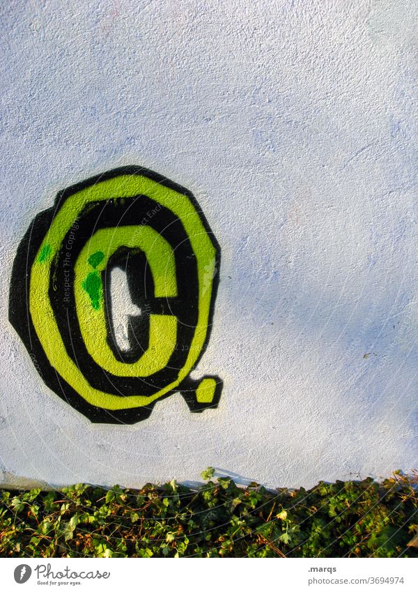 C letter c Wall (building) White Yellow green Plant copyright Symbols and metaphors Graffiti Characters