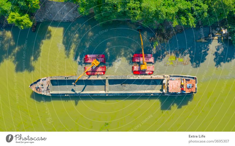 Aerial view of river, canal is being dredged by excavator Above Activity Backhoe Barge Boat Bucket Charge Civil Engineering Clean Dig Digger Dredge Dredger