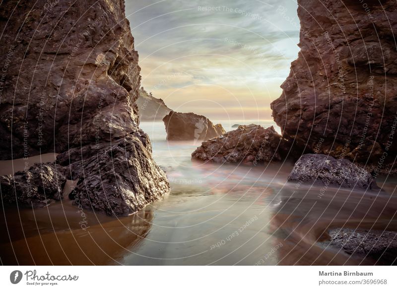 Rocks in the pacific ocean at sunset, California. Long exposure headlands marin long twilight california travel beach outdoor sea long exposure tourism coast