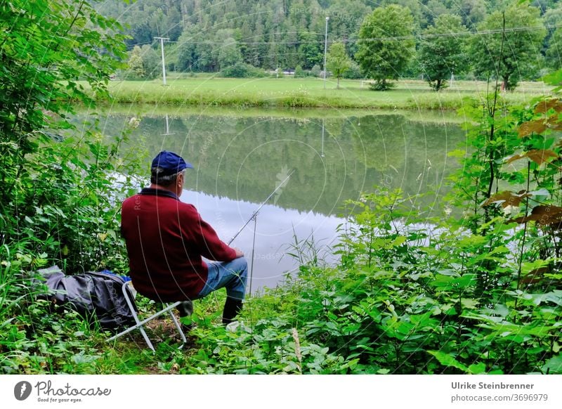 Angler sitting on the riverbank in the green Fishing (Angle) Water Fisherman sit in River River bank shrubby Forest Relaxation silent tranquillity Catch fish
