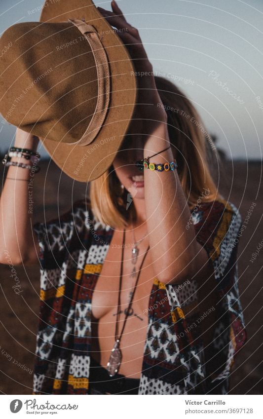 Boho girl in the country side in a moon sky background female lonely looking wind sunrise concept impossible come true vacation storm people lifestyle horizon