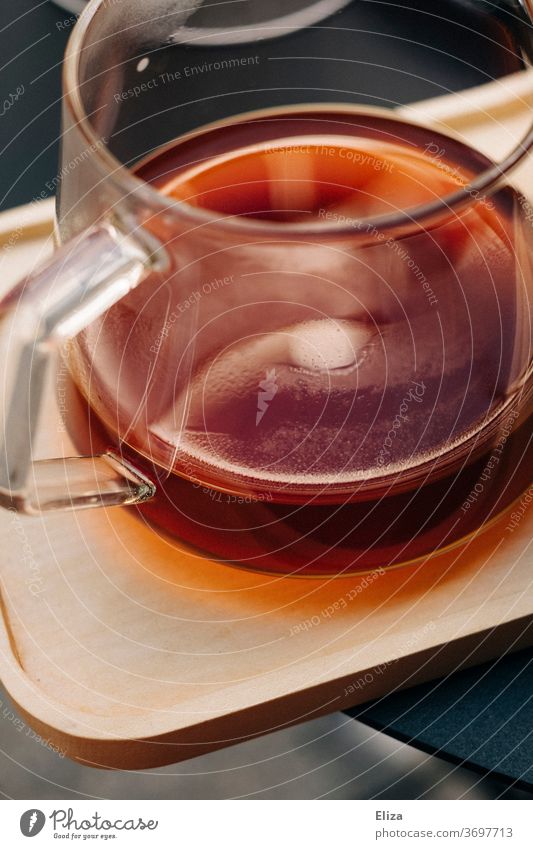 A glass jug with freshly brewed coffee on a wooden tray Coffee pot filter coffee Caffeine Aromatic Tea Teapot warm Hot Morning Breakfast Beverage Coffee break