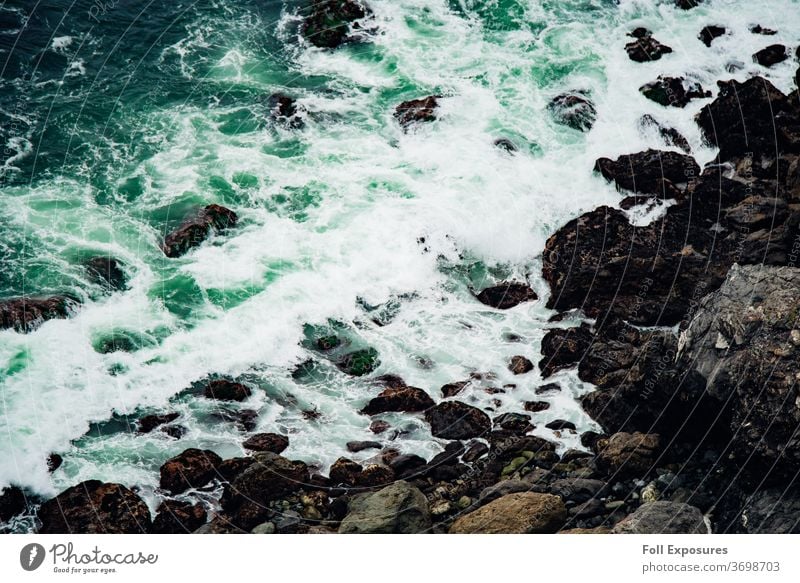 Seafoam green waves crash upon the ocean shoreline in Big Sur, California beach california Exterior shot Pacific Ocean Vacation & Travel Colour photo Coast