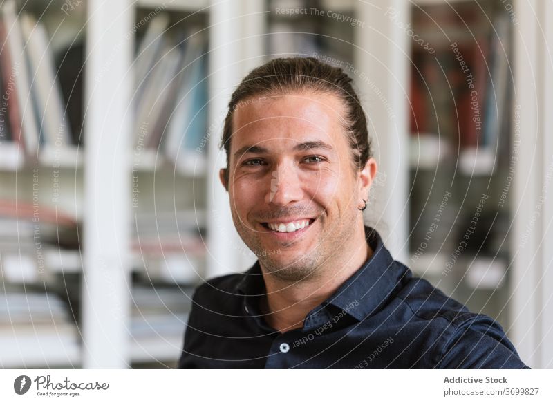 Smiling man in bright office worker workspace contemporary job content table male smiling modern formal business workplace handsome manager career executive